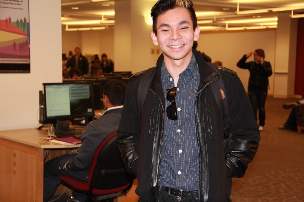 Thinh Nguyen, Creative Advertising Major.  Wearing clothing from Rumors and other thrift stores.