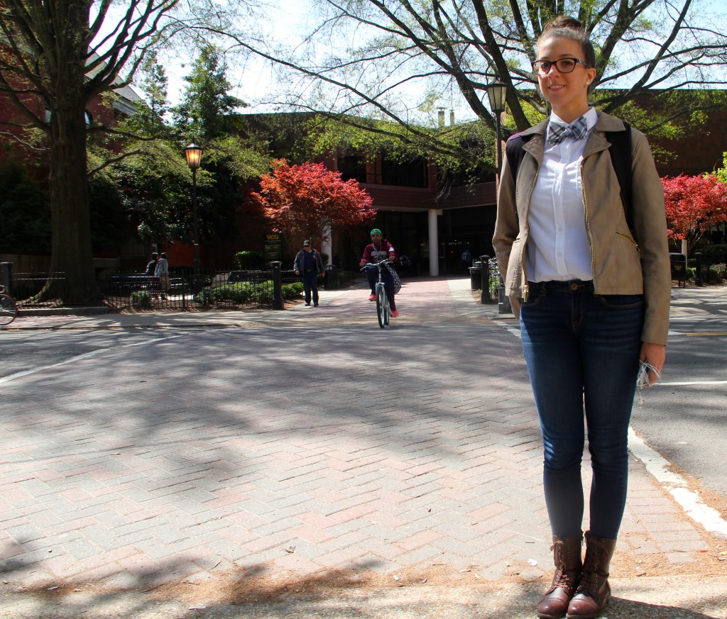 Elizabeth Urena, Communication Arts major, wearing a shirt and jeans from H&M, bow tie from a friend, and gifted boots.