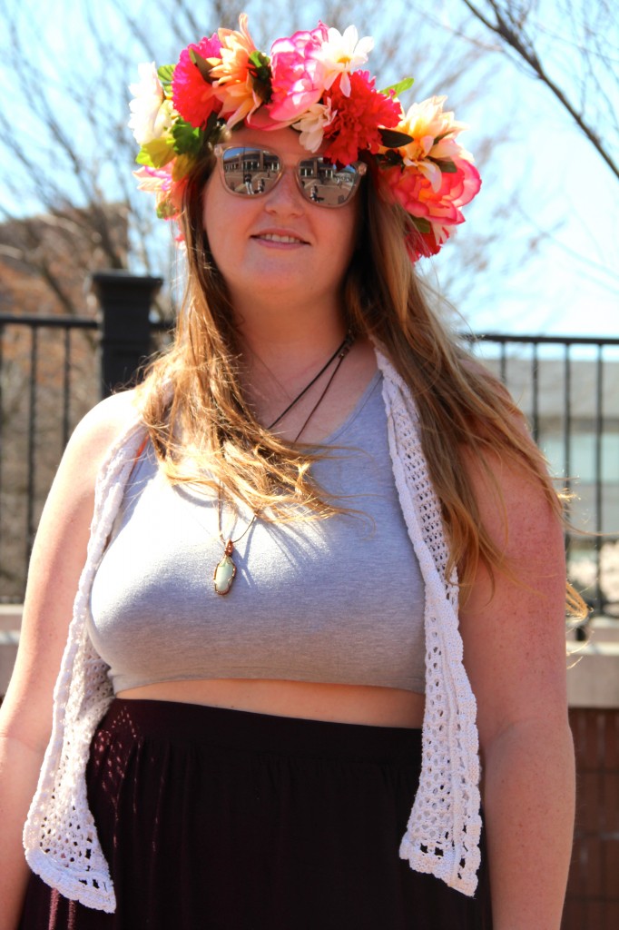 Kristin Longest, Business Administration and Management major, wearing a crop top from Nordstrom, an H&M skirt, vest from Kohl's, sunglasses by Knock Around, and a flower crown she made herself.