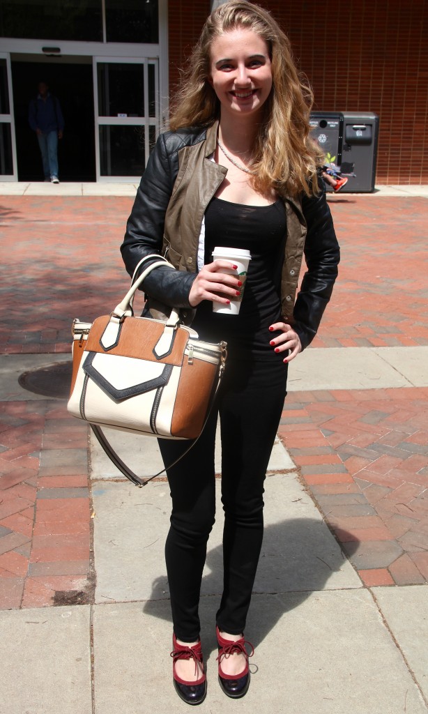 Emily McGee, Fashion Merchandising major, wearing a bag by Aldo.