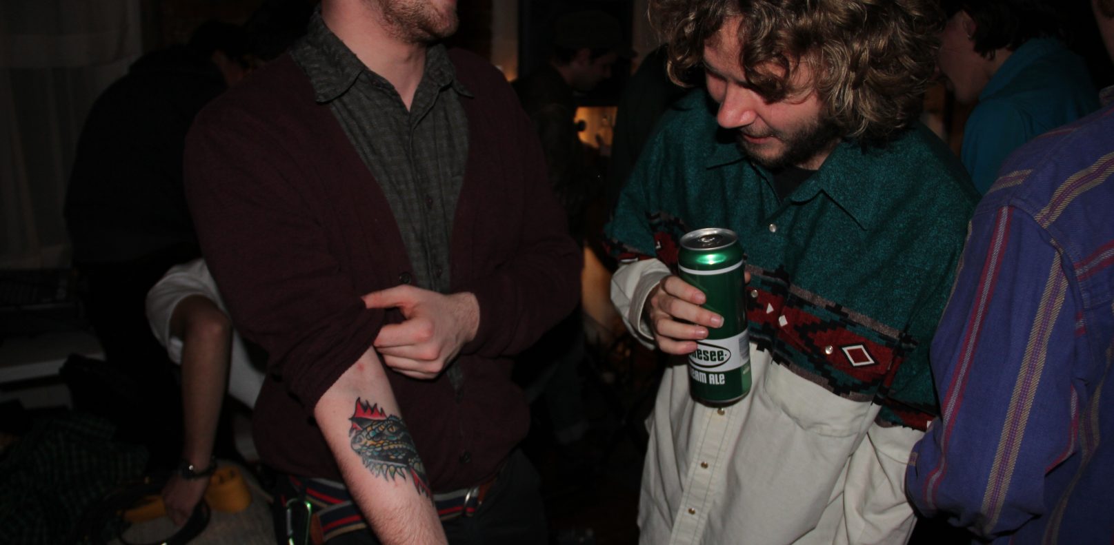 Alex Van Horn showing off his new iguana tattoo.